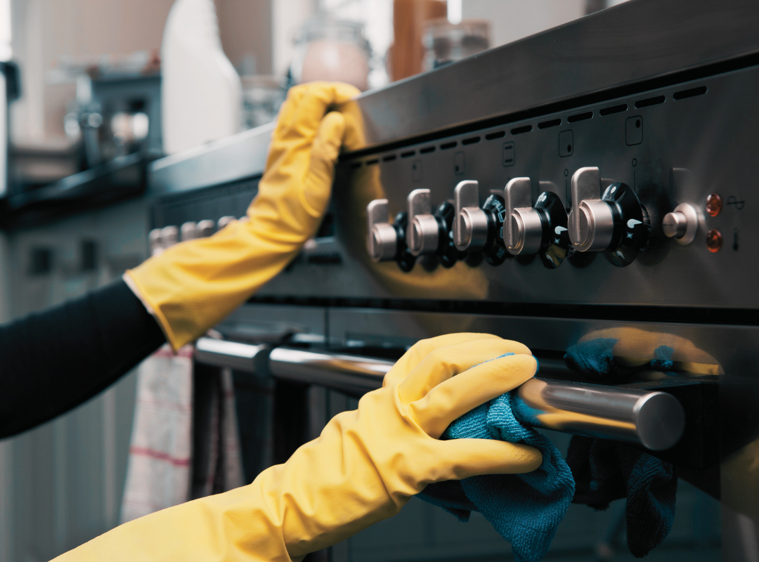 Sell your property online - person cleaning the oven